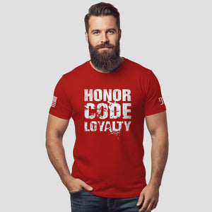Man wearing a red t-shirt with 'Honor Code Loyalty' text on a light gray background