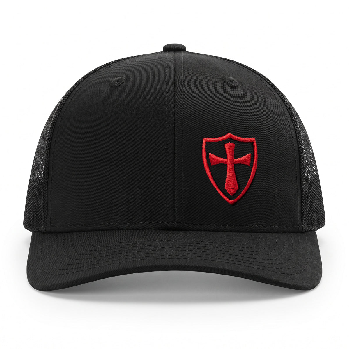 Straight front view of the black and red Crusader Cross trucker hat showing the shield embroidered off-centre on the front panel