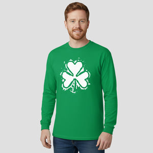 Man wearing a green long-sleeve shirt with a white shamrock design on a light gray background