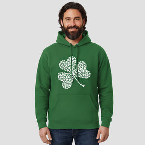 Man wearing a green hoodie with a white shamrock design on a light gray background