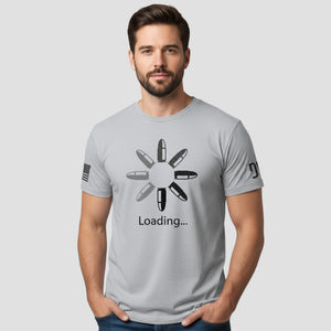 Man wearing a gray t-shirt with a graphic design and text on a white background