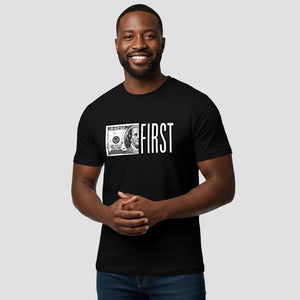 Man wearing a black t-shirt with a graphic design and text on a plain background