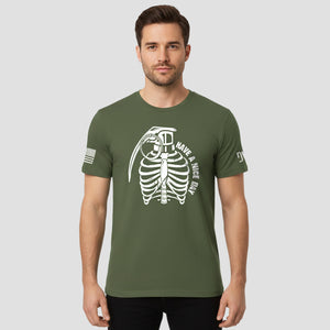 Man wearing a green t-shirt with a graphic design on a plain background