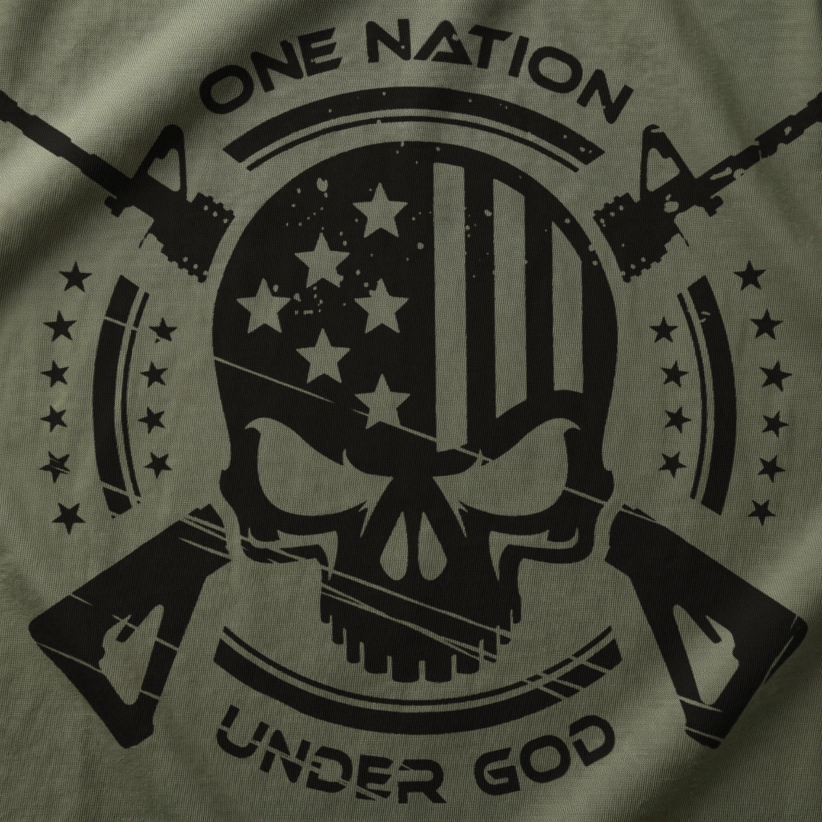 Close-up of the One Nation Under God back print on Military Green cotton: matte black skull with American flag, crossed rifles and stars (digitally composited print visualization)