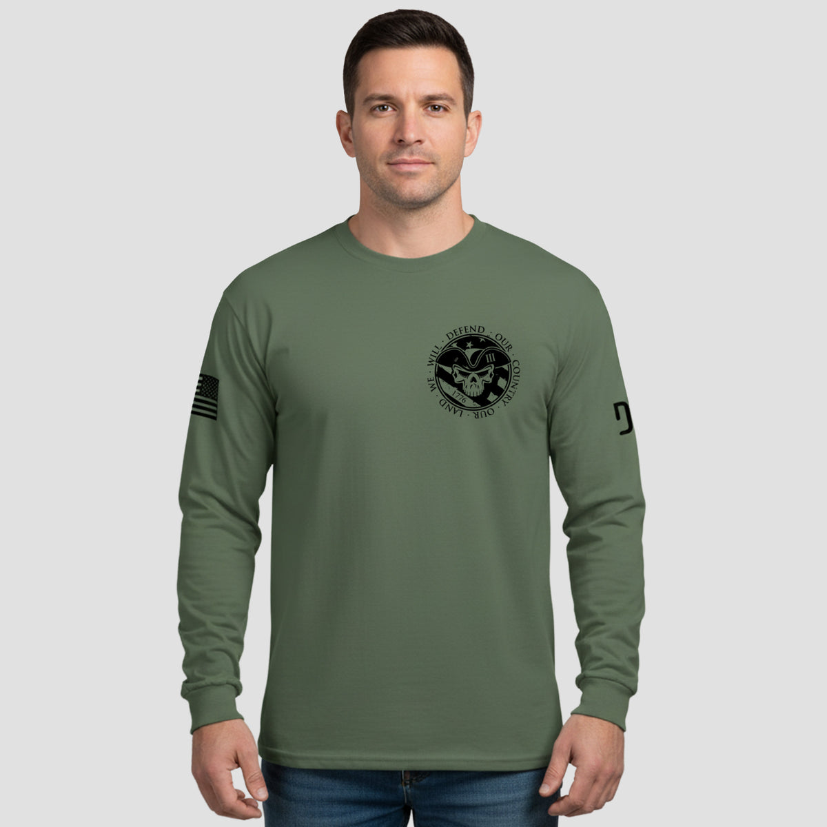 Man wearing a green long-sleeve shirt with a logo on a gray background
