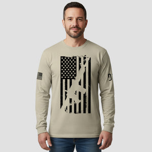 Man wearing a long-sleeve shirt with an American flag design on a plain background