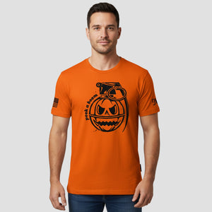 Man wearing an orange t-shirt with a black graphic design on a light gray background