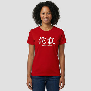 Person wearing a red t-shirt with white wabi sabi text on a plain background